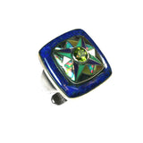 Inlay peridot ring by Kelly Charveaux